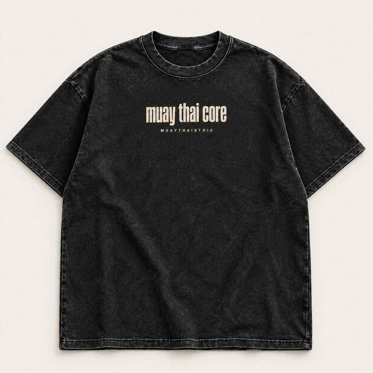 Front-view digital mockup of the washed-charcoal Muay Thai Core tee with a bone-colored chest wordmark.